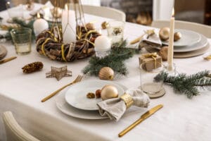 Beautiful table setting with Christmas decorations in living room