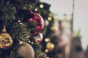 bauble hanging from a decorated Christmas tree